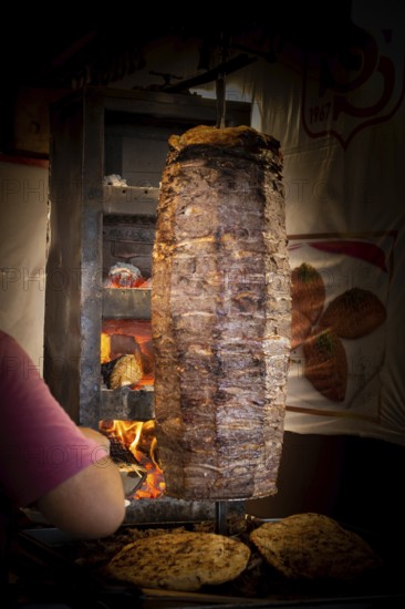 Traditional Turkish food Doner Kebab. Turnspit skewing kebap kebab shawarma