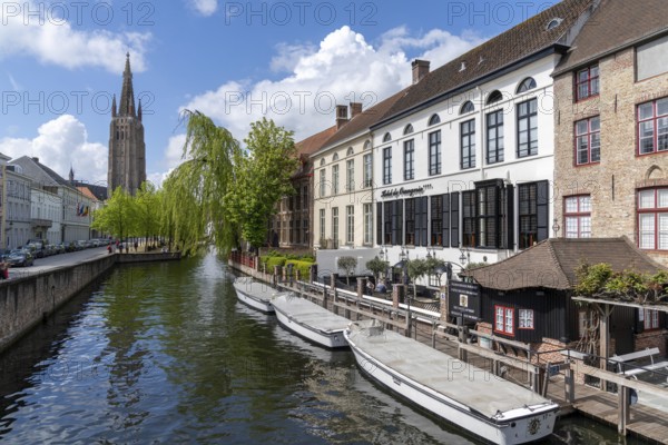Bruges, Belgium - 12 May, 2021: view of the historic city center and canals in downtown Bruges