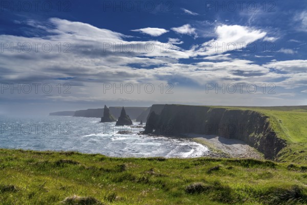A view of the Duncansby Sea Stacks and wild and rugged coastline of Caithness in the Scottish Highlands