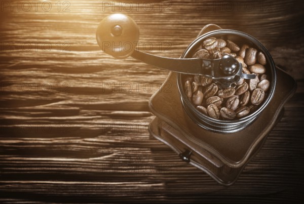 Coffee grinder natural grains on vintage wooden board