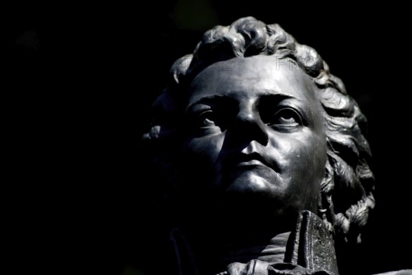 Closeup of Bronce Portrait of Wolfgang Amadeus Mozart on Kapuzinerberg, Salzburg, Austria, Europe