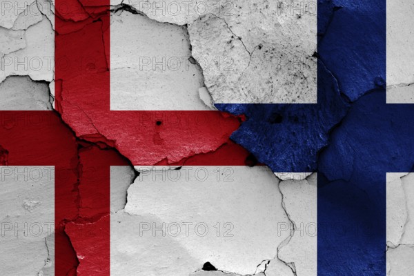 Flags of England and Finland painted on cracked wall