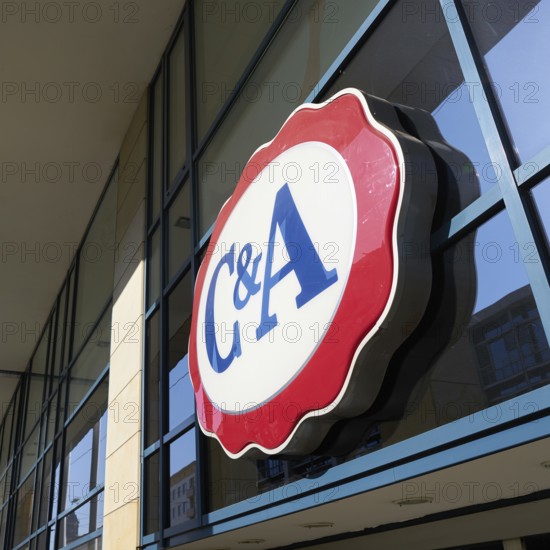 Illuminated advertising at a branch of the clothing discounter C&A in the city centre of Magdeburg