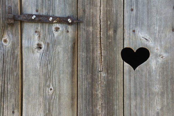 Old wooden door with heart