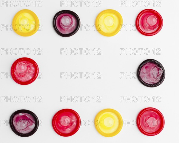 Flat lay arrangement colorful condoms with copy space