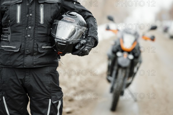 Men riding motorcycle winter day