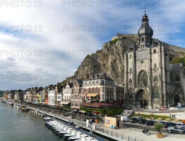 Belgium - 11 August 2019: horizontal view of the Meuse River and the historic old riverside town of Dinant in Belgium