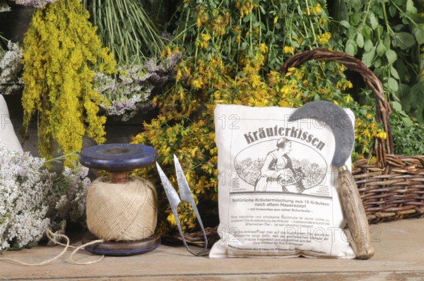 Herbal pillows and herbs hung to dry, St. John's wort, yarrow, mint, lemon balm, bedstraw (Hypericum perforatum) (Achillea millefolium) (Galium verum), herbal pillows