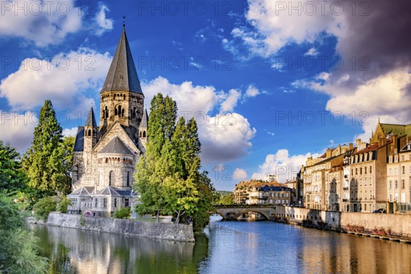 METZ, FRANCE - AUG 5, 2022: The old town architecture of Metz at the Moselle river, France, Europe