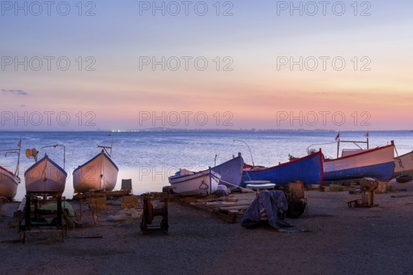 Pomorie, Bulgaria beachfront sea panorama with fishing boats in the town and seaside resort on Black sea, sunset view