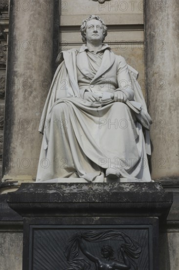 An upright shot of a statue to Germany's most famous poet and writer Johann Wolfgang (von) Goethe (1749 –1832), who is widely regarded as the greatest and most influential writer in the German language. Semper opera, Dresden, Germany Semperoper in Dresden