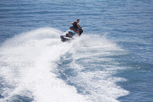Spain, Majorca, Balearic Islands, Calvia region, Santa Ponca, Port Adriano, jet ski, on the sea, at full speed, man, m58, while driving, sea, waves, Europe