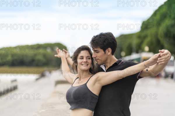 Couple in love holding their arms outstretched