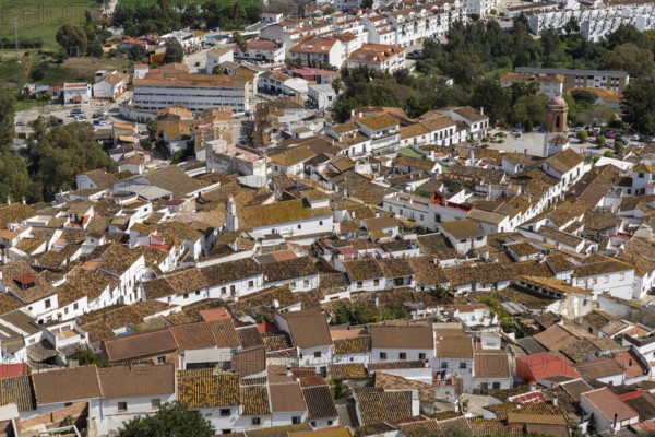 Jimena de la Frontera, Spain - 9 March, 2022: whitewashed village of Jimena de la Frontera high angle view with rooftops and church
