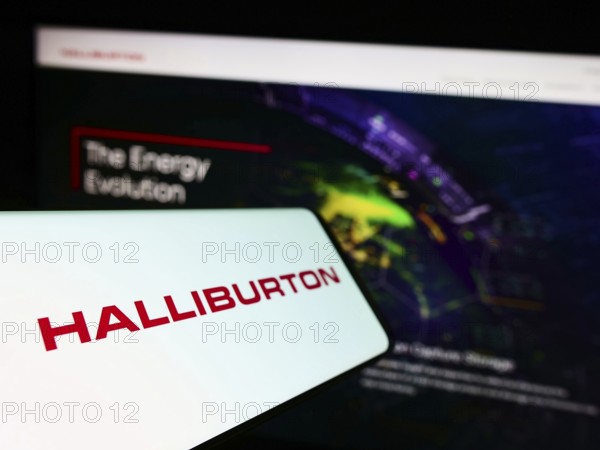 Stuttgart, Germany, 10-26-2022: Cellphone with logo of American fracking company Halliburton on screen in front of business website. Focus on left of phone display, Europe