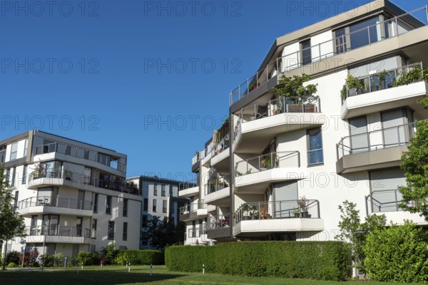 New apartment buildings seen against a blue sky in Munich, Germany, Europe