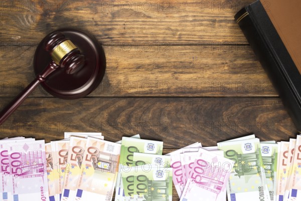 Top view arrangement with judge gavel book money