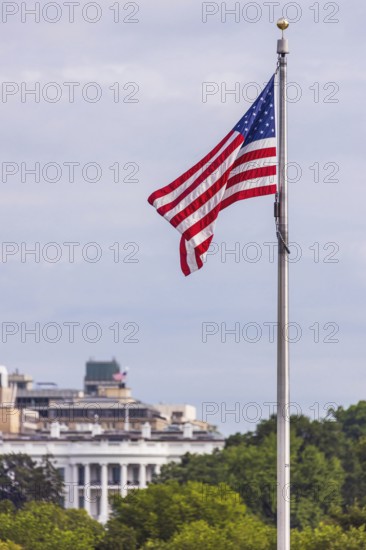 American Flag with the White House in the background