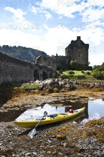 Kayak in front of Eilean Donan Castle, Scotland, United Kingdom, Europe