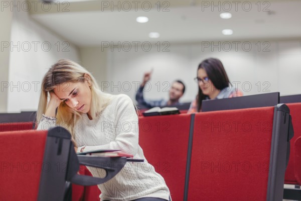 Group students sitting boring seminar