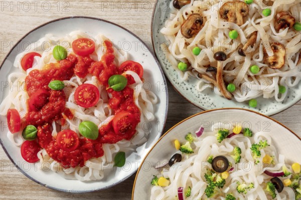 Konjac pasta with tomato sauce, mushrooms, and broccoli, shot from the top