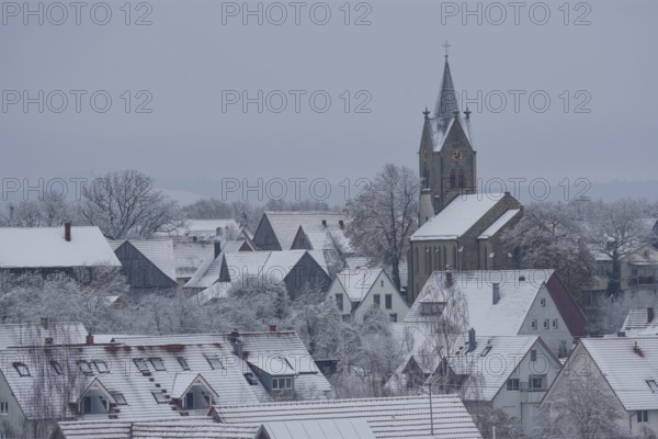 Snow-covered village church in Bibersfeld, Swabian-Franconian Forest nature park Park, Bibers, Biberstal, Schwäbisch Hall, Hohenlohe, Heilbronn-Franconia, Baden-Württemberg, Germany, Europe
