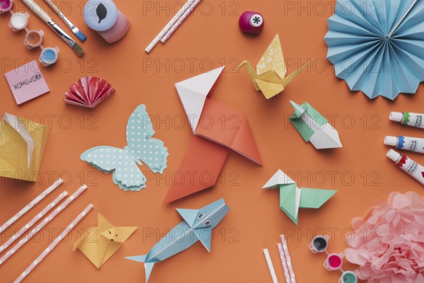 set origami paper art paintbrush watercolor straw orange backdrop. Resolution and high quality beautiful photo