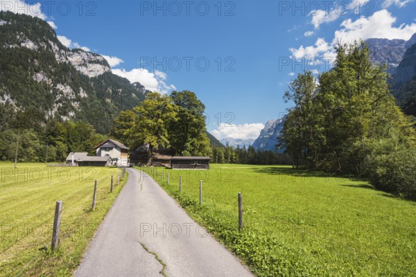 Farm track with farm settlement and Vorauen inn, Klöntal, Canton Glarus, Switzerland, Europe