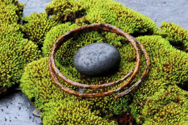 Stone and rusty metal ring