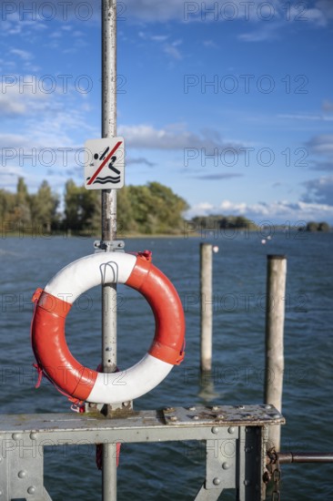 Lifebuoy and pictogram for bathing ban on the shore of Lake Constance, Radolfzell, Konstanz district, Baden-Württemberg, Germany, Europe
