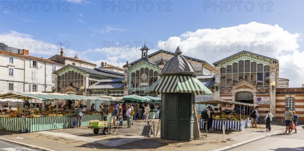 Market stalls in front of the historic market hall in the old town, La Rochelle, Atlantic coast, Aquitaine, New Aquitaine, France, Europe