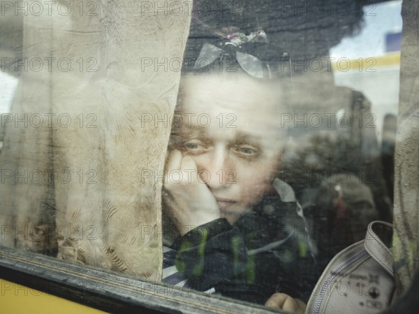 Arrival of refugees from occupied Kherson in the car park of a shopping centre, the two buses were each on the road for a total of seven days without a break, they were turned back several times by Russian units, the route finally led them to the territory of the DNR, where they were threatened to be shot all or a mock execution was suggested, Zaporizhia, Ukraine, Europe