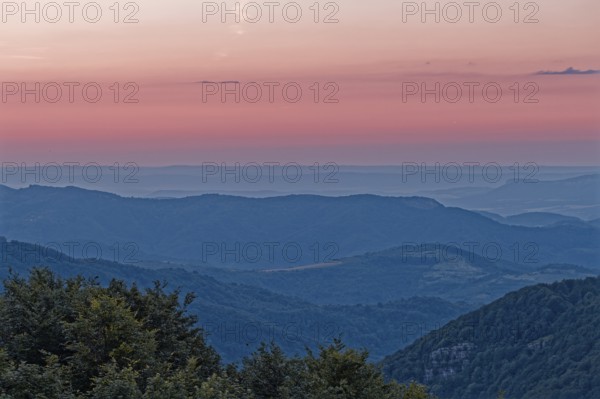 Dawn over the mountain landscape of the Balkan Mountains and the wooded slopes of the Balgarka nature park Park in Central Bulgaria. Shipka, Gabrovo, Bulgaria, South-East Europe, Europe