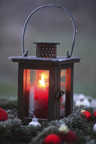 Lantern with burning candle, Christmas decoration