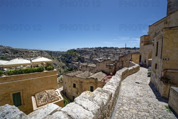 The Sasso Caveoso district and the towering rock church of Santa Maria dell'Idris in the cave town of Matera, a UNESCO World Heritage Site, with dwellings, corridors and buildings made of tuff. Matera, Basilicata, Southern Italy, Southern Europe