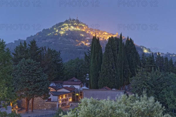 The illuminated mountain village of Fardella in the evening landscape of Basilicata in the Pollino National Park. Fardella, Basilicata, Southern Italy, Southern Europe