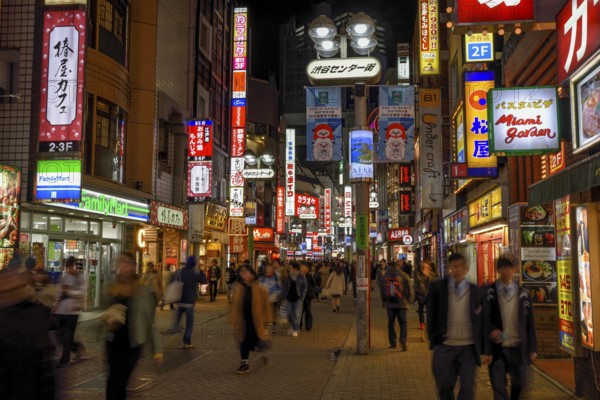 Street scene in the Shibuya district at night, Tokyo, Japan, Asia