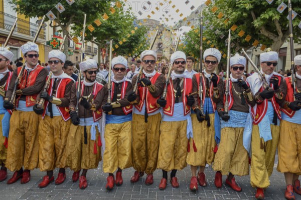 Group in traditional clothing, Moors and Christians Parade, Moros y Cristianos, Jijona or Xixona, Province of Alicante, Costa Blanca, Spain, Europe