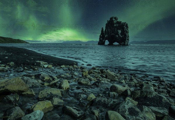 Hvitserkur landscape at night with beautiful Northern Lights. Iceland