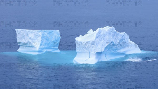 Iceberg seen from cruise ship vacation near Greenland coast in Arctic circle near Ilulissat Disko Bay