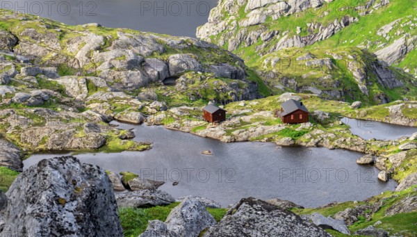 Mountain landscape with Munkebu mountain hut and small lakes, view from the ascent to Munken, Moskenesøya, Lofoten, Nordland, Norway, Europe