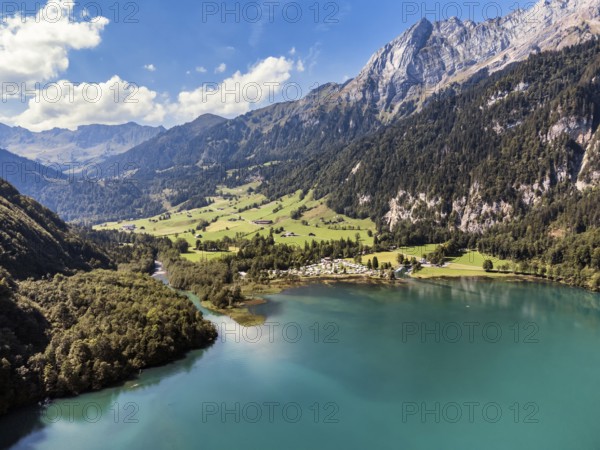 The Vorauen campsite on Lake Klöntal with the Chlü tributary and the 2294-metre-high Mutteristock, Klöntal, Canton Glarus, Switzerland, Europe