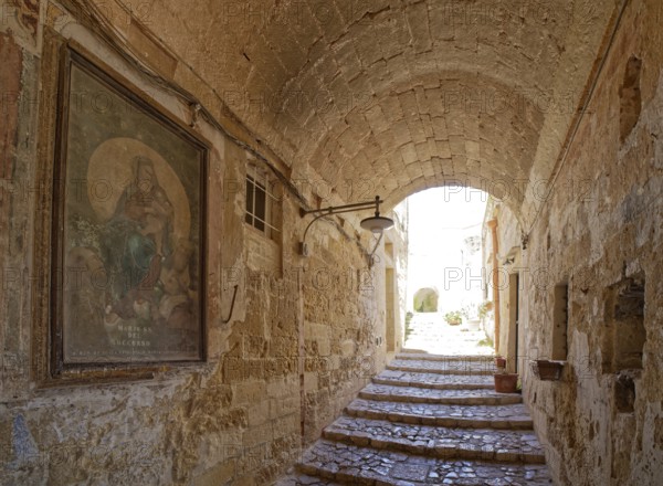 Paths and corridors in the tuff of the Sassi Barisano in the cave town of Matera. The cave settlements, Sassi, are a UNESCO World Heritage Site. Matera, Basilicata, Southern Italy, Southern Europe