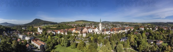 Aerial view of the old town of Engen with the Church of the Assumption of the Virgin Mary, on the left the Hegau volcanoes Hohenhewen and Hohenstoffeln, Constance district, Baden-Württemberg, Germany, Europe