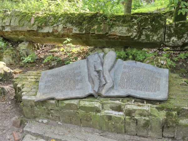 Memorial plaque for the Hitler assassin Claus Schenk Graf von Stauffenberg at the Wolf's Lair (also Wolfschanze or Görlitz), the military situation centre of the command staff of the German Wehrmacht. The Wolf's Lair is now a museum. Gierloz, Ketrzyn, Warmia-Masuria, Poland, Europe