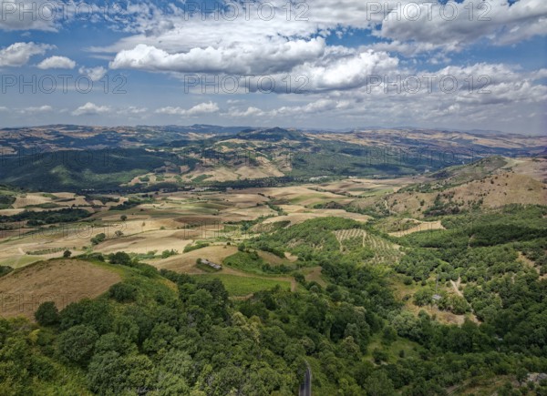 Aerial view of the varied hilly landscape of Basilicata in the north of the Italian province of Potenza. Foggianello near Melfi, Basilicata, Southern Italy, Southern Europe