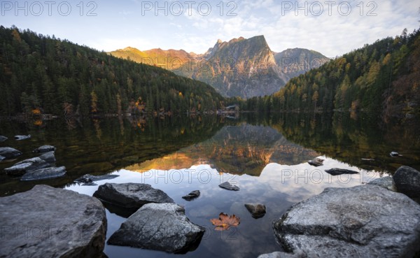 Mountain peaks of the Ötztal Alps reflected in Lake Piburger See, in autumn, near Ötz in Ötztal, Tyrol, Austria, Europe