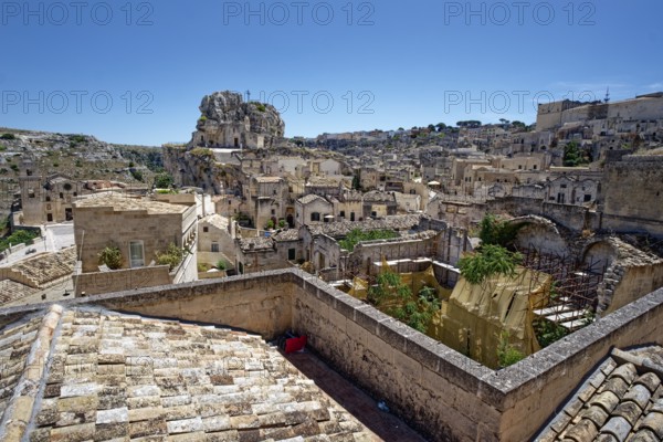 The rock church of Santa Maria dell'Idris towers over the Sasso Caveoso district in the cave town of Matera. The cave settlements, Sassi, are a UNESCO World Heritage Site. Matera, Basilicata, Southern Italy, Southern Europe