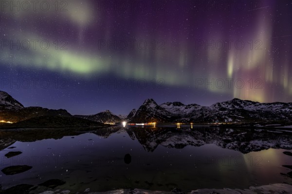 Northern lights over fjord, steep mountains, winter, aurora borealis, Flakstadoya, Lofoten, Norway, Europe