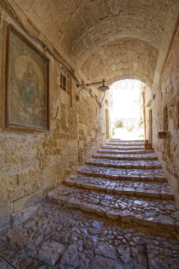 Paths and corridors in the tuff of the Sassi Barisano in the cave town of Matera. The cave settlements, Sassi, are a UNESCO World Heritage Site. Matera, Basilicata, Southern Italy, Southern Europe